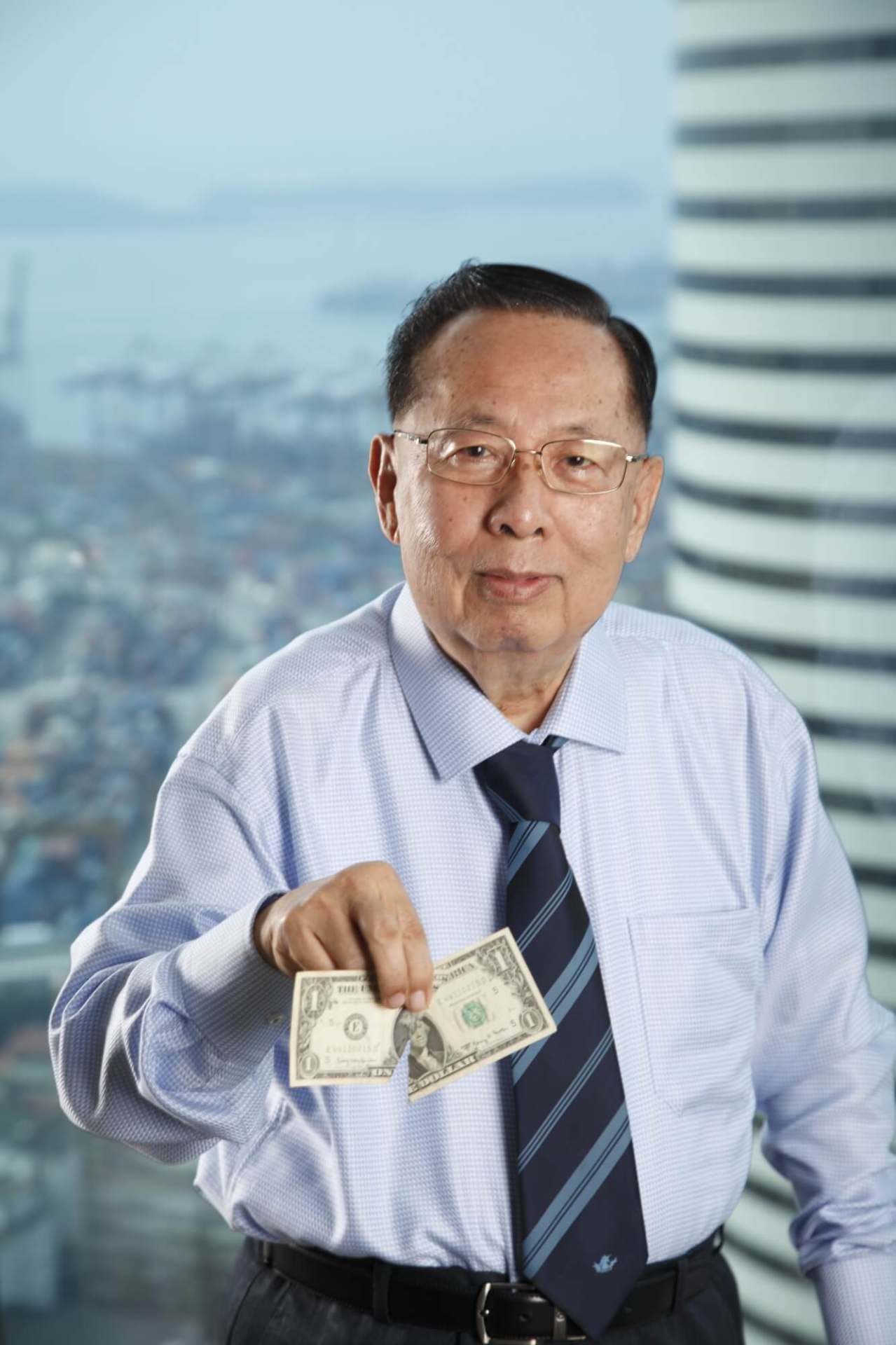 Photo: Mr Ngiam Tong Dow with the original torn US dollar note
